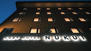 A building with a sign reading 'COZY HOTEL NUKUI' and multiple windows. - Cozy Hotel Nukui Yawatahama (Yawatahama)
