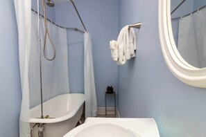 Shower, hair dryer, towels, shampoo