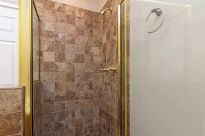 Shower, hair dryer, towels, shampoo