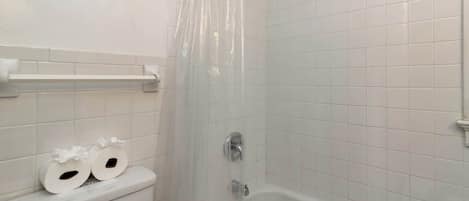 Shower, hair dryer, towels, shampoo