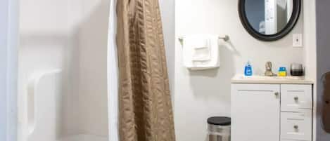 Shower, hair dryer, towels, shampoo