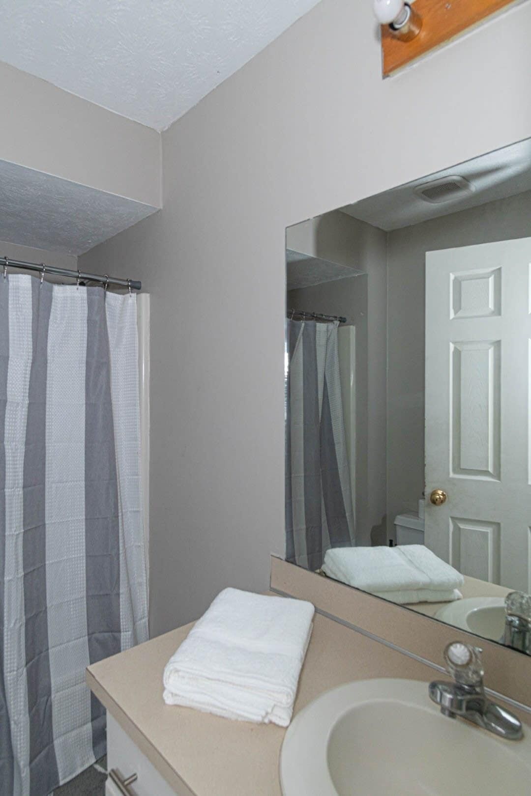 Shower, hair dryer, towels, shampoo