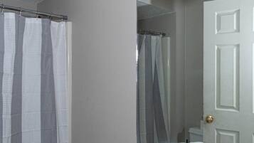 Shower, hair dryer, towels, shampoo