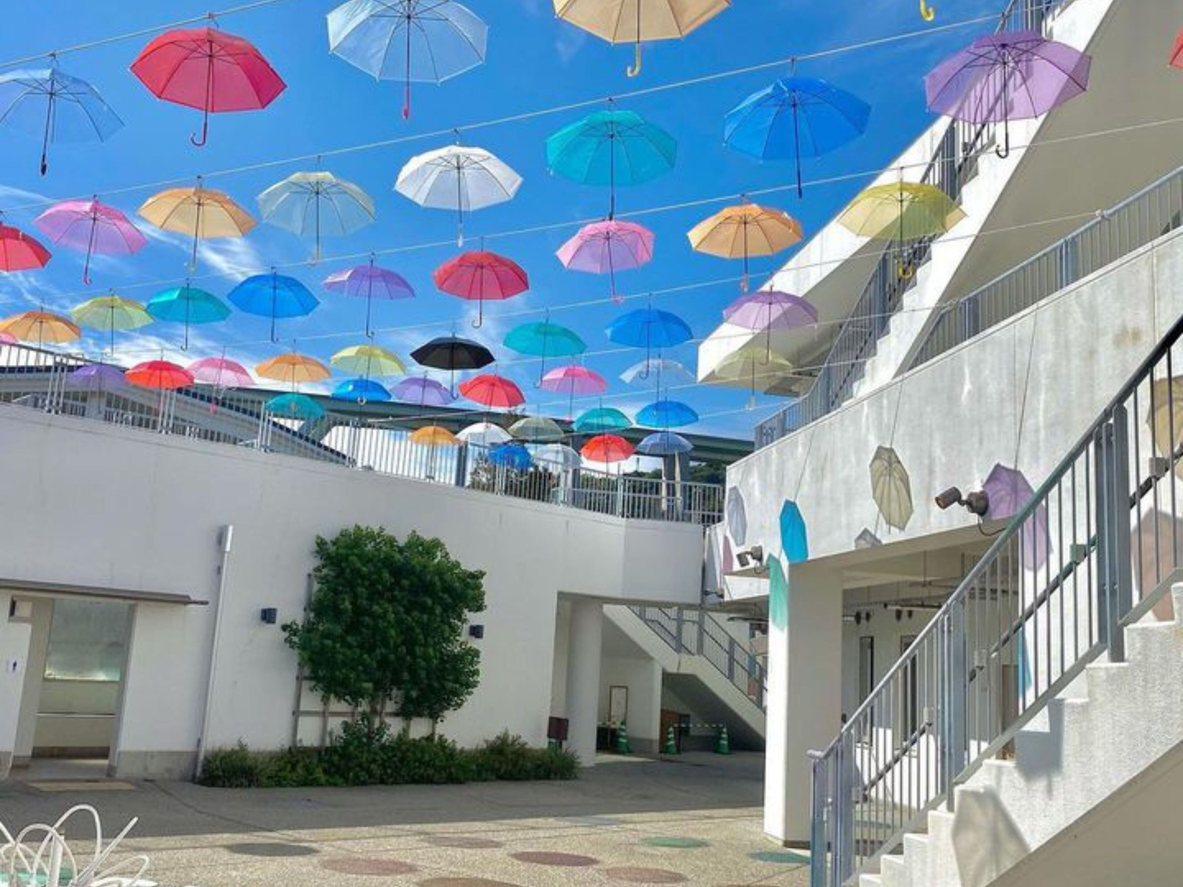 A covered outdoor area with multiple levels and a staircase.