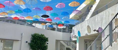 A covered outdoor area with multiple levels and a staircase.