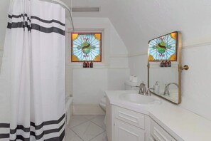 Shower, hair dryer, towels, shampoo