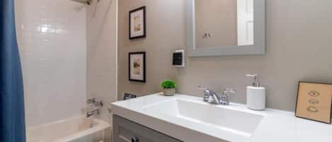 Shower, hair dryer, towels, shampoo