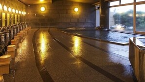 A wet indoor space with benches, a tiled floor, and a large window. - Shiganosato Onsen Ikoinomura Notohantou (Shika)