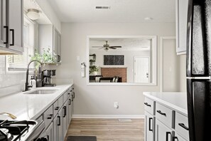 Fridge, microwave, oven, stovetop - The Parkside Retreat | Near DT • Walking Trails! (Indianapolis)