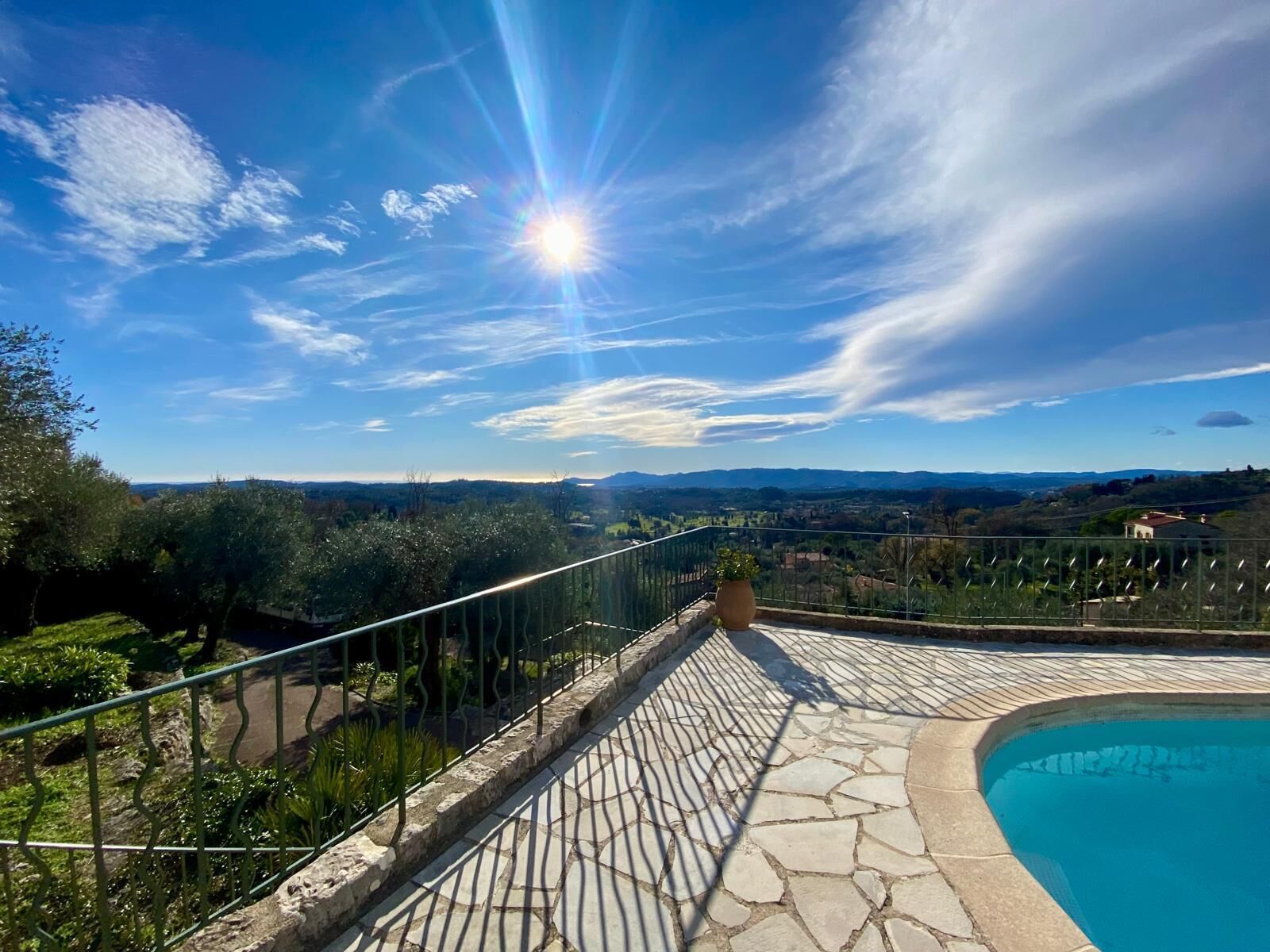 A pool area with a clear view of the surrounding landscape.