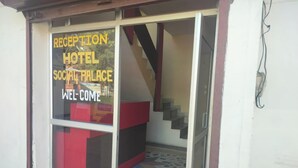A reception area with a sign that reads 'RECEPTION HOTEL SOCIAL PALACE WELCOME'. - Saalak Lite Social Palace  (Ukhimath)