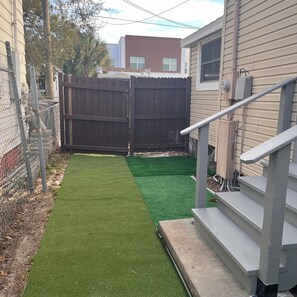 Property grounds - Location Location 
Mini Jr. Suite. 1-bedroom queen bed behind barn doors. (Tampa)