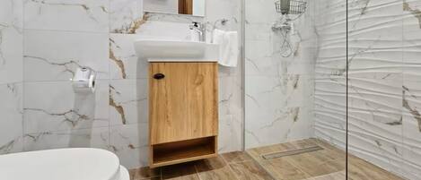 Shower, hair dryer, towels, soap