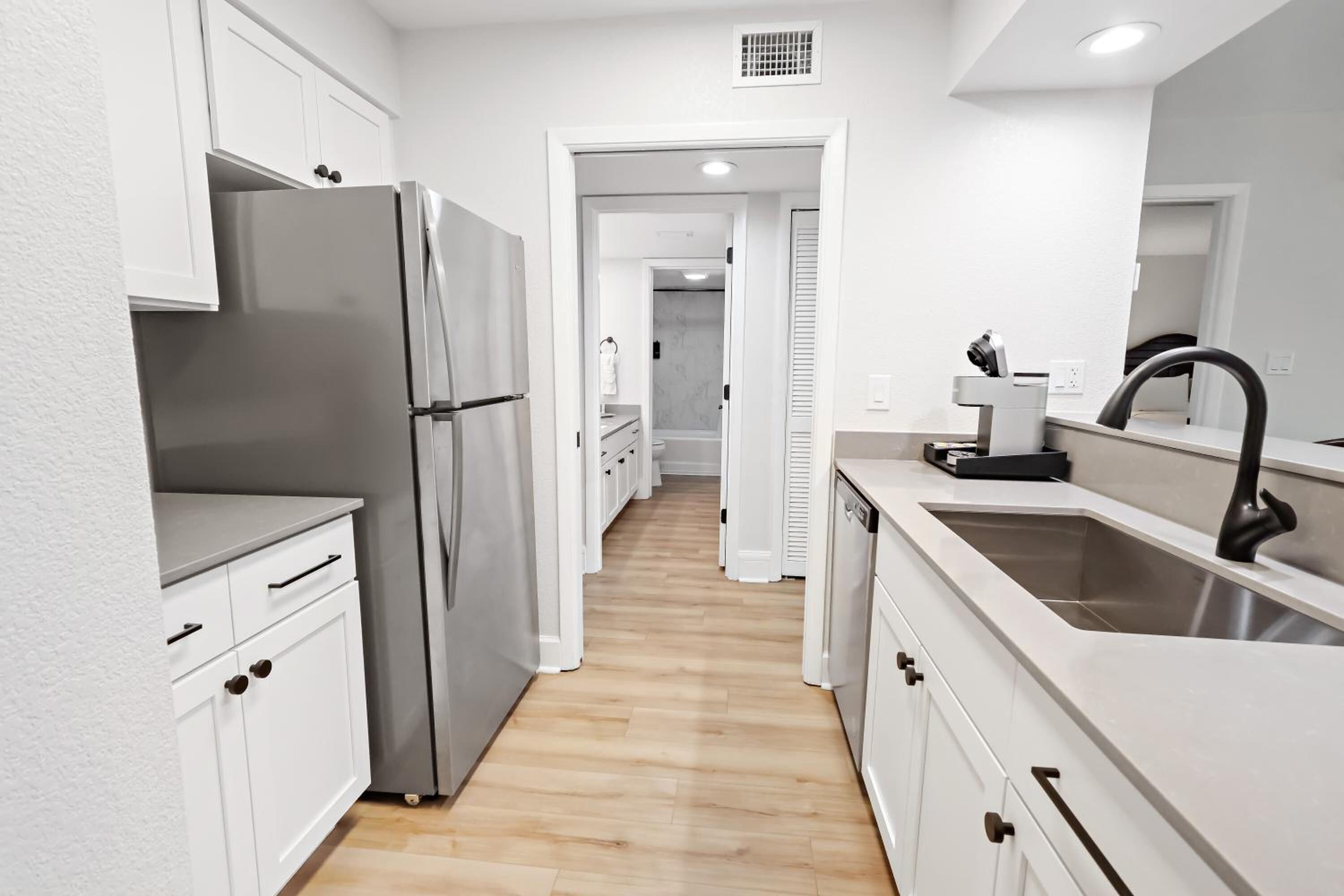 Fridge, microwave, stovetop, coffee/tea maker