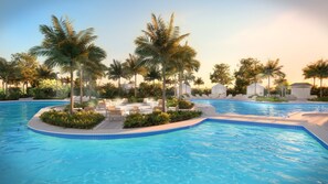 Ein Swimmingpool mit Liegestühlen und Palmen.