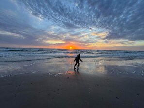 A person walking on a beach during sunset. - 4 Star Holiday Home in Lokken (Lokken)