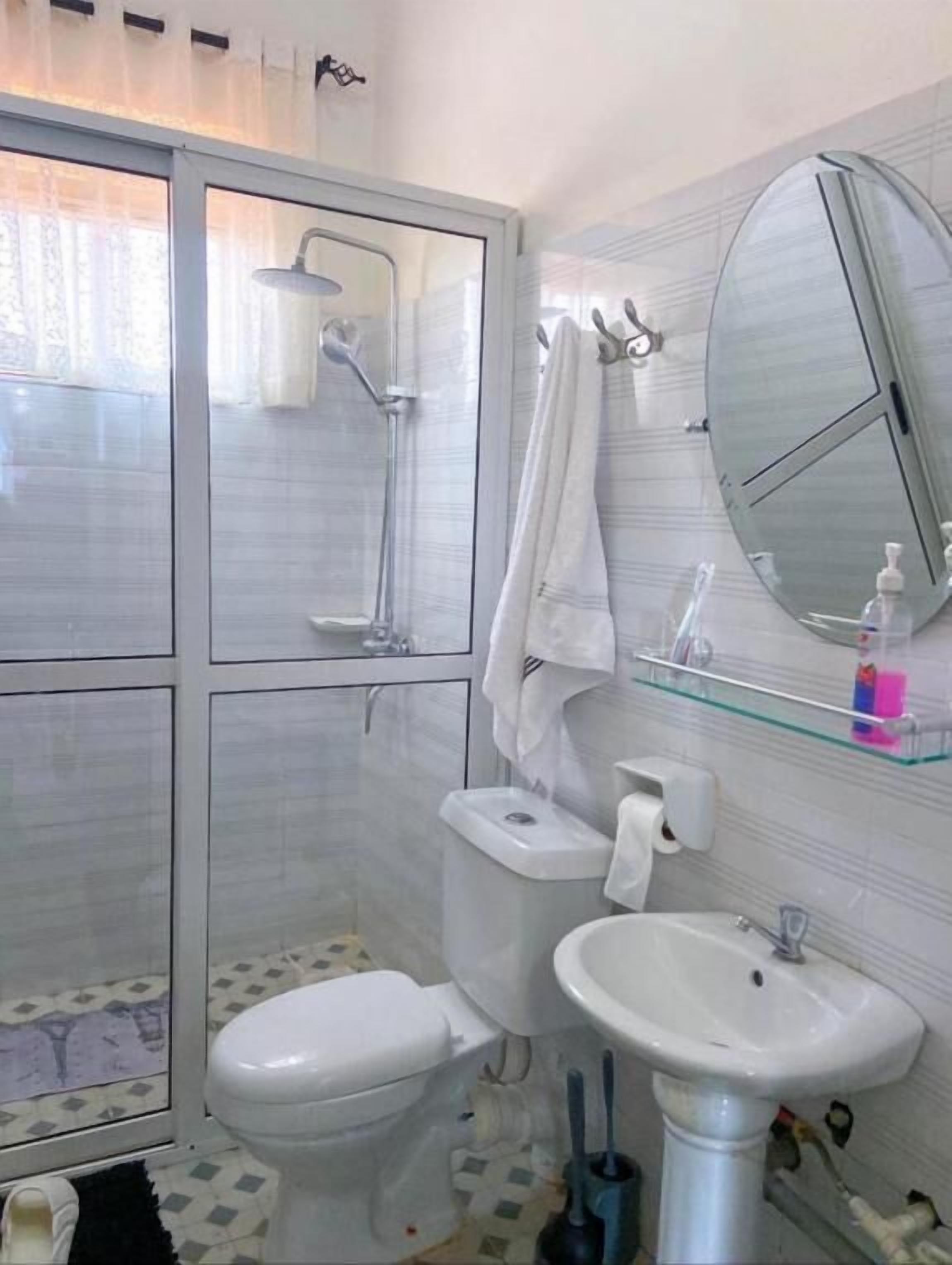 Shower, hair dryer, slippers, towels