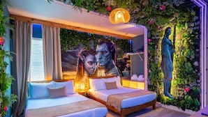 A bedroom with two beds, a mural, and a statue. - 11BR Luxury Villa w/ Pool Near Disney (Orlando)