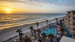 A resort with a pool, beach, and ocean view. - Seafront Double | The Shores | Oceanfront views, firepits | 2 Units (Daytona Beach)
