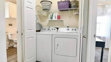 Shower, hair dryer, towels, shampoo