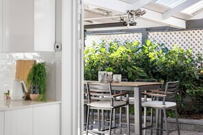 Outdoor dining - Solara Sunlit Alfresco Living with Sauna (Glenelg North)