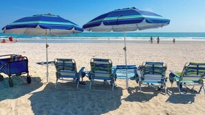 A beach with umbrellas and lounge chairs. - Walk 2 Beach |Theater, Games, Putt, Pool, Sleep 22 (North Myrtle Beach)