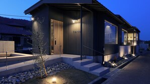 A modern building with a flat roof, large windows, and a well-lit entrance. - Torch Amano-hashidate (Yonezawa)