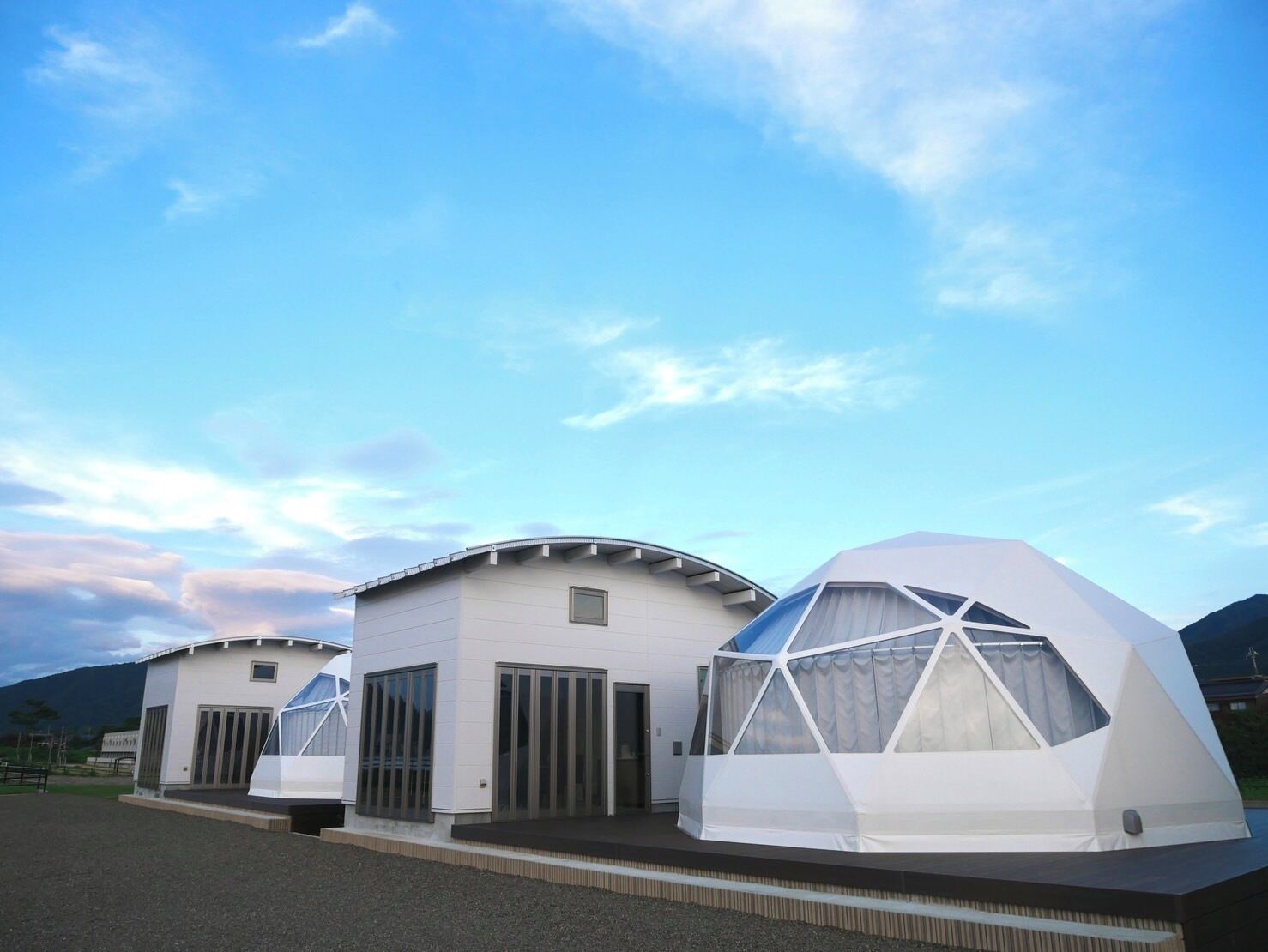 A modern building with a flat roof and large windows.