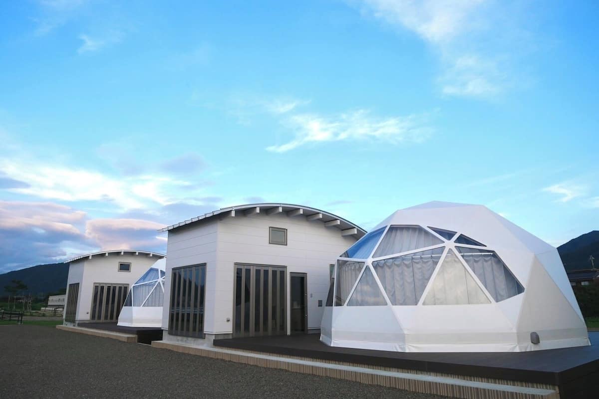 A modern building with a flat roof and large windows.