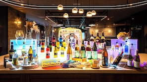 A bar area with various bottles and a fan of cards.
