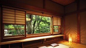 A traditional Japanese room with tatami flooring, a low wooden bench, and a large window with shoji screens. - Kansuirou (Kaga)