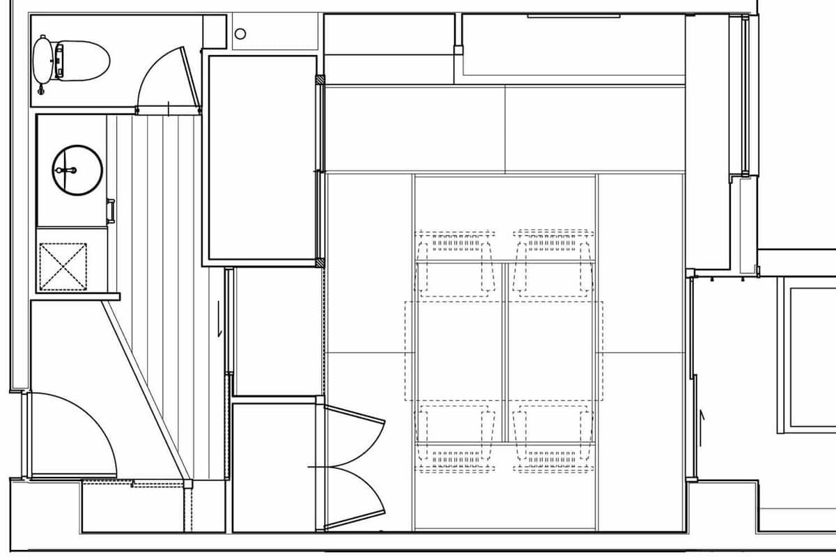 A floor plan with a central open space, multiple rooms, and a circular feature.