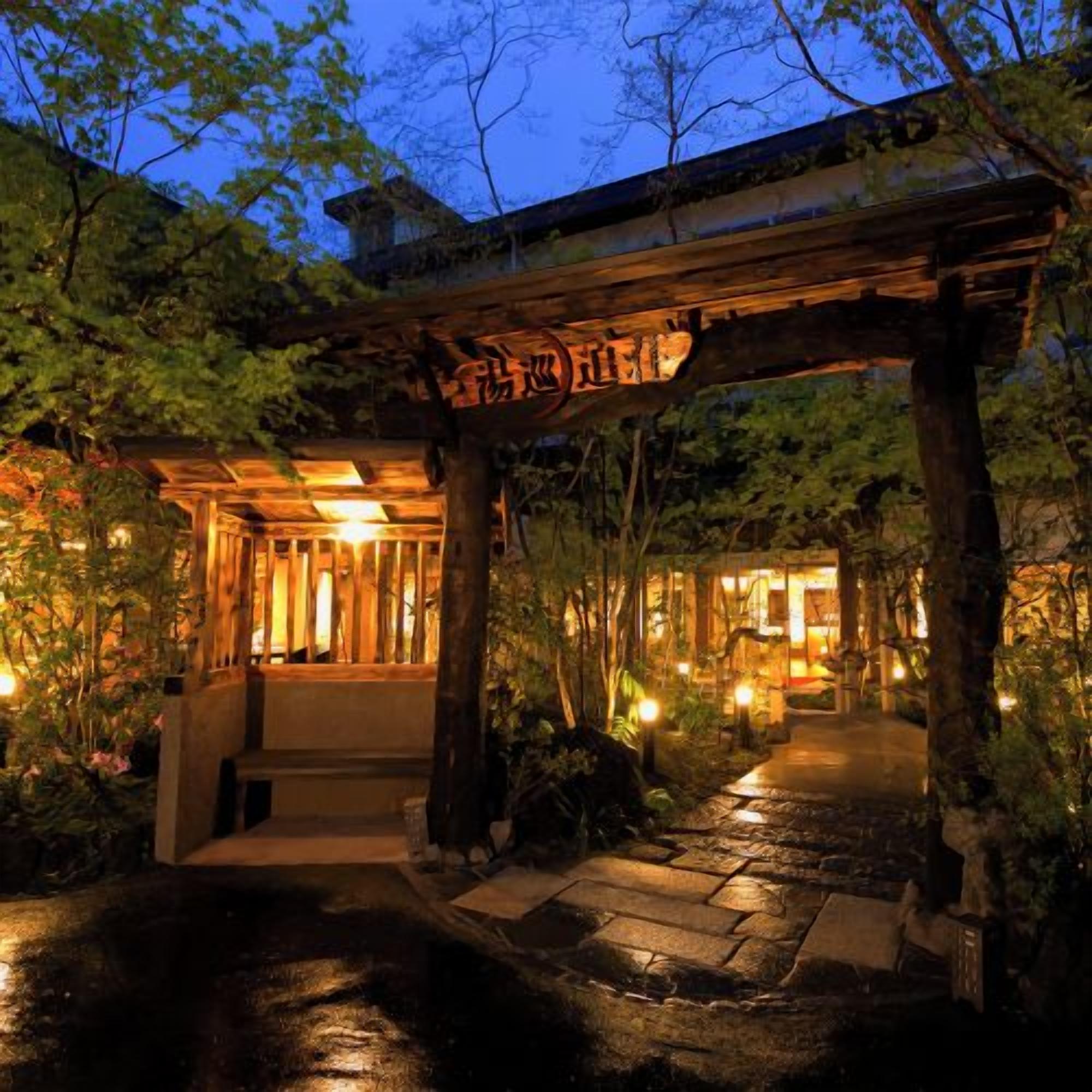A traditional Japanese building with a wooden entrance archway.