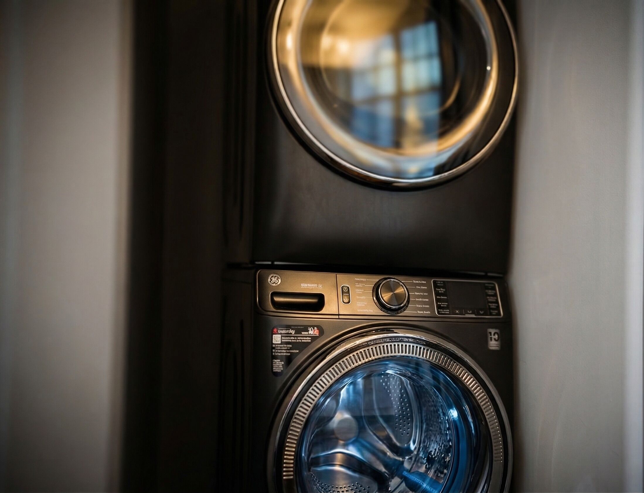 A front-loading washing machine with a control panel and a circular door.