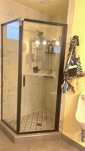 Shower, hair dryer, towels, soap