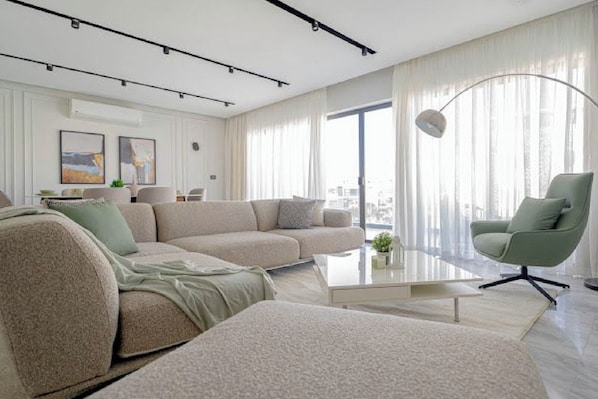 Living area - 3 BR Apt Lake View - Mynt Hospitality (New Cairo)
