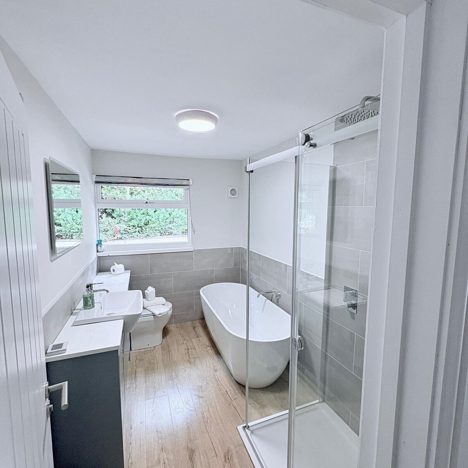 Shower, hair dryer, towels, toilet paper