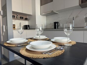 Family Apartment, Balcony, City View | Dining - Oceana Suites Santa Elena (Santiago)