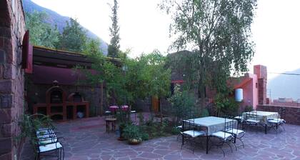 Authentic Berber mountain stay with panoramic Atlas views and Moroccan food.