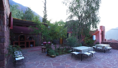 Authentic Berber mountain stay with panoramic Atlas views and Moroccan food.
