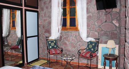 Authentic Berber mountain stay with panoramic Atlas views and Moroccan food.