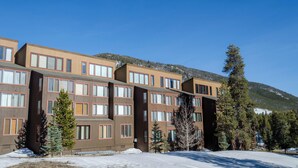 A multi-story hotel with a modern design, featuring large windows and a flat roof. - Lodgepole #2020 (Keystone)