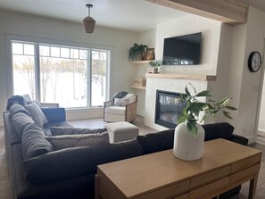 Smart TV, fireplace, table football, books