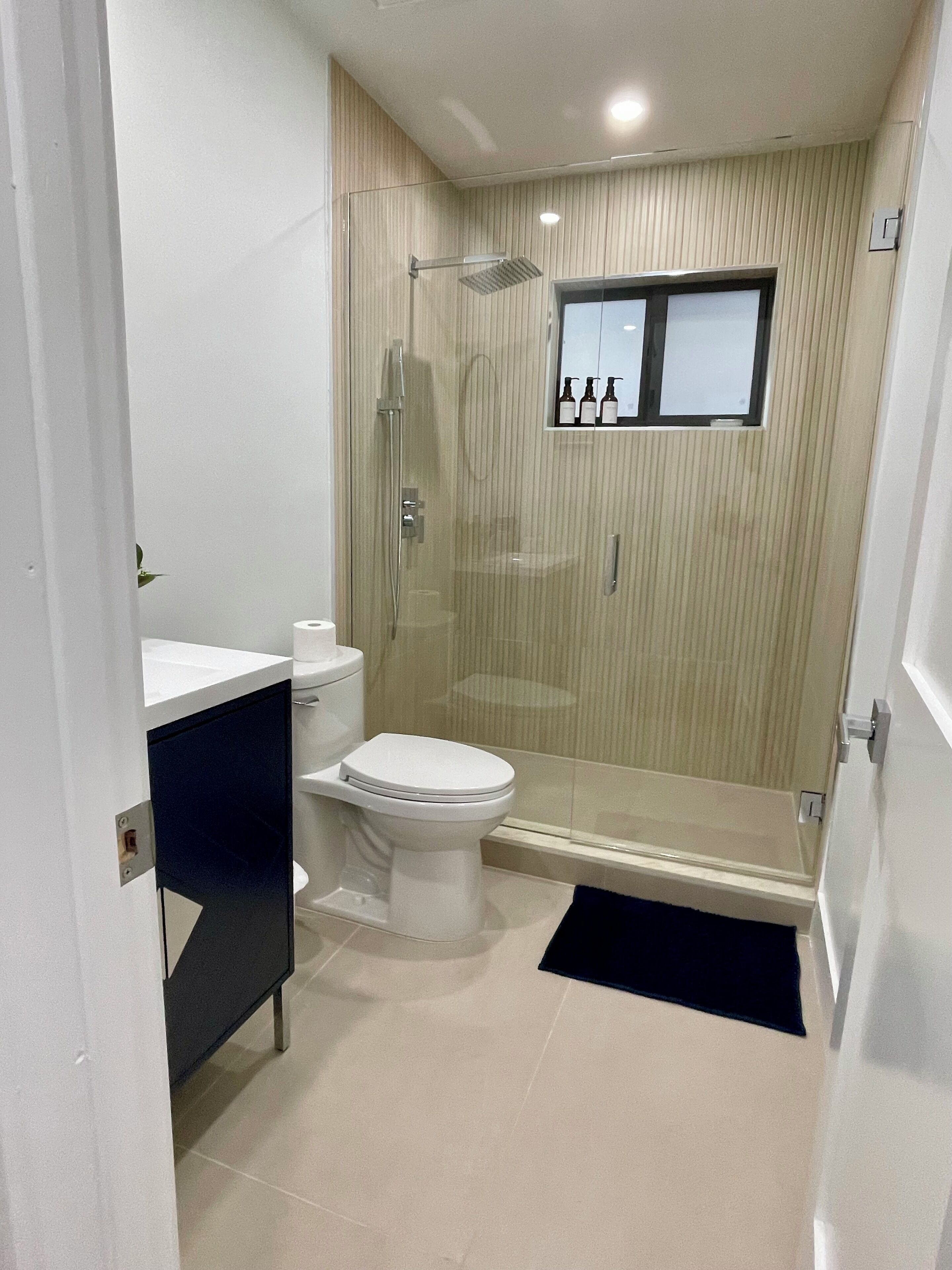 Shower, hair dryer, towels, soap