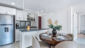Fridge, microwave, stovetop, coffee/tea maker
