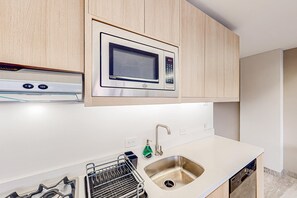 Fridge, microwave, oven, stovetop - Downtown condo with great views, shared pool, hot tub, & grill (San José del Cabo)