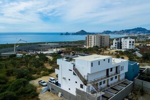 Exterior - Ocean view condo with scenic balcony, well-equipped kitchen, internet, & W/D (Cabo San Lucas)