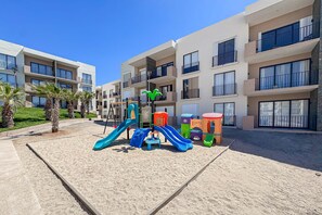 Children’s area - Bright and modern condo w/ balcony, shared pool, a/c, minutes to beach & town (Cabo San Lucas)
