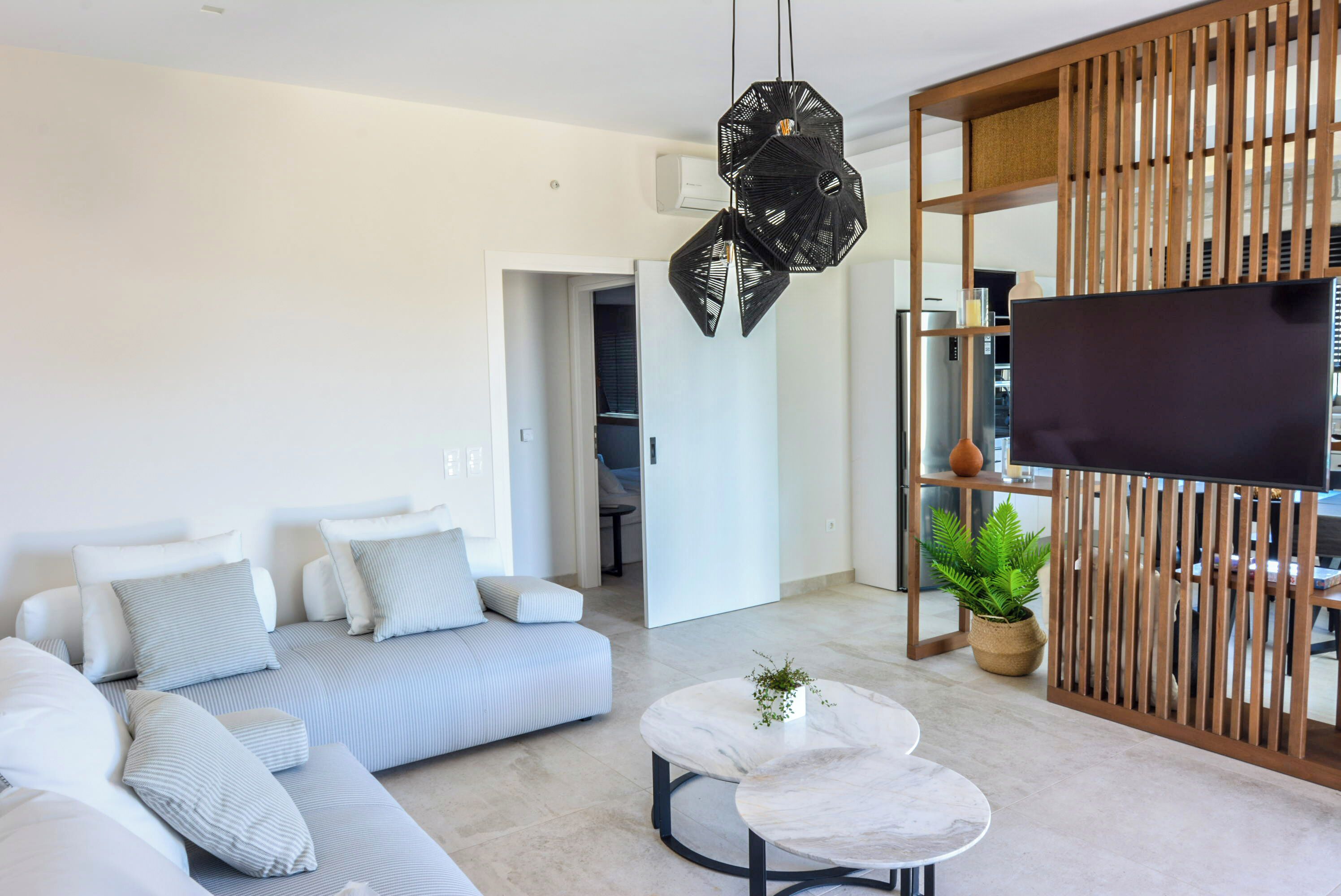 Suite superior, vista parcial al mar | Área de sala de estar