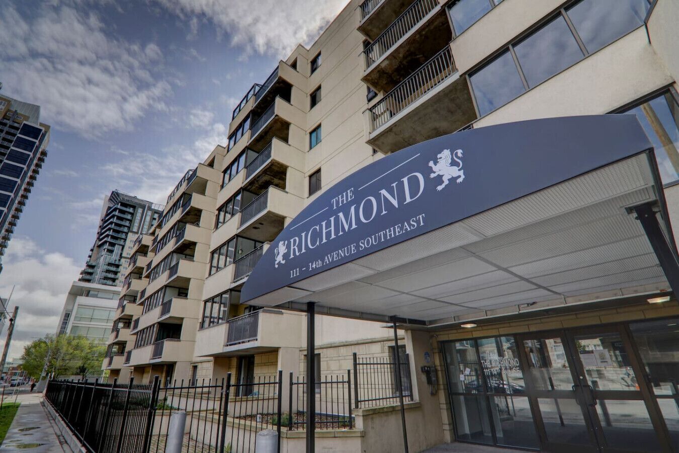 A multi-story building with a sign reading 'The Richmond 111-14th Avenue Southeast.'